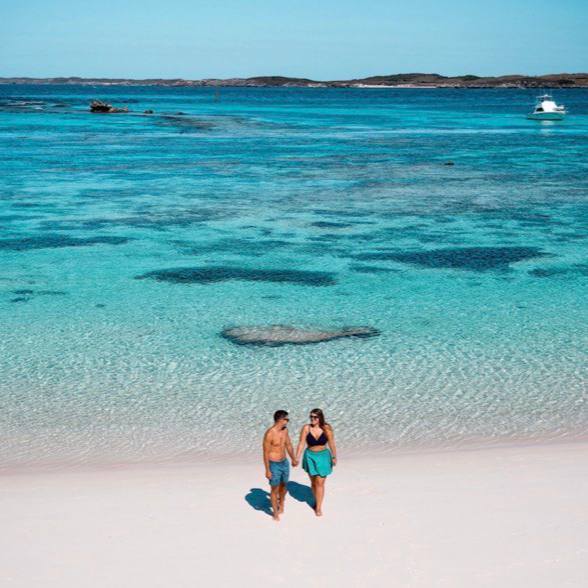two people on a beach in Rottnest island